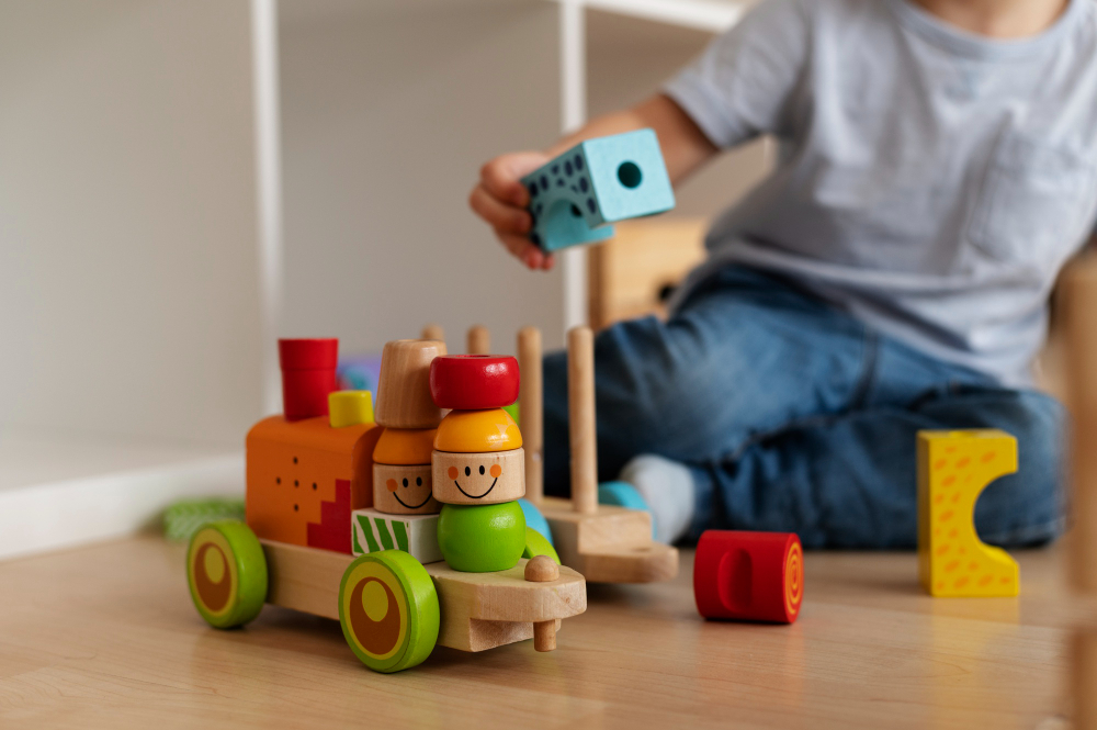 front-view-kid-playing-with-wooden-toyds